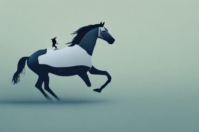 A horse and rider galloping through a hazy landscape