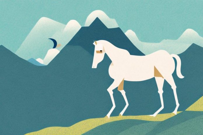 A horse in a mountain landscape with a saddle on its back
