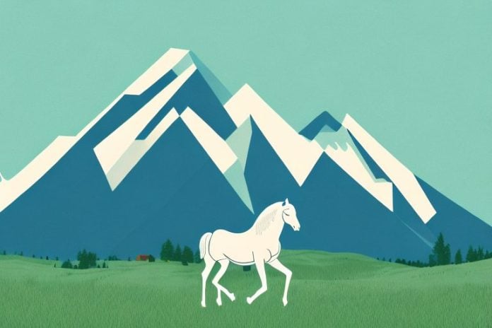 A horse in a field with a mountain in the background