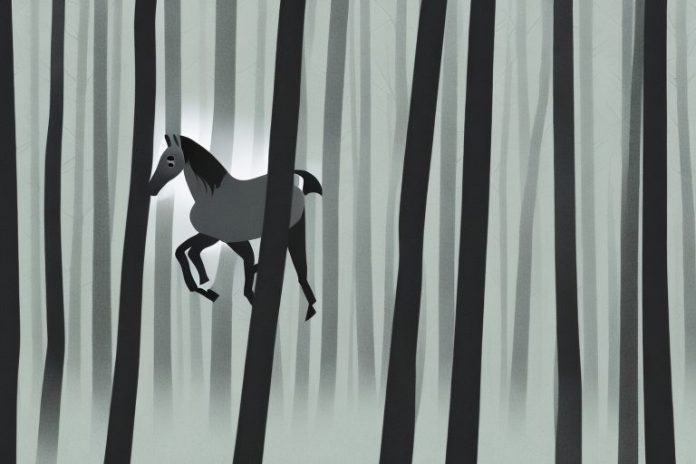 A horse running through a forest of tall black trees